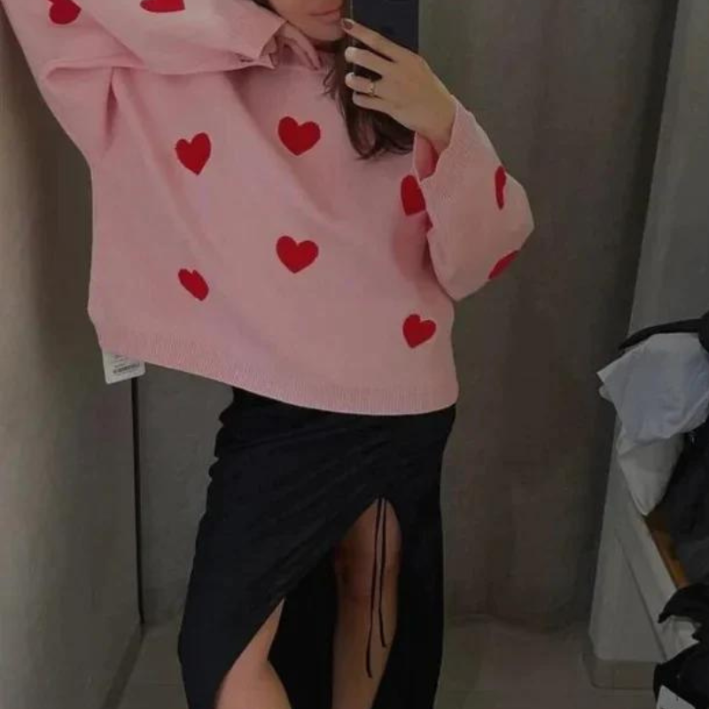 Pull coeurs en tricot doux rose pour une touche de douceur et de féminité tra