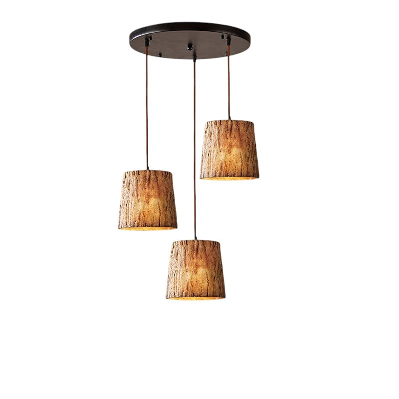 Pendant lamp made of wooden logs