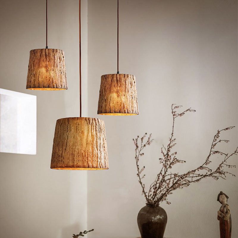 Pendant lamp made of wooden logs
