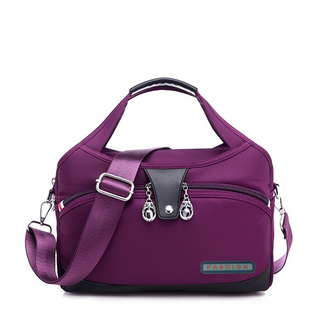 Sac à main WanderChic violet en polyester durable et rangement spacieux pour femmes